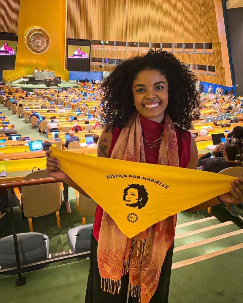 Foto mostra Lígia sorrindo durante o primeiro dia do Fórum Permanente de Pessoas Afrodescendentes das Nações Unidas